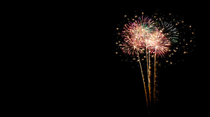 Fototapeta premium Colorful fireworks display in night sky, creating festive atmosphere