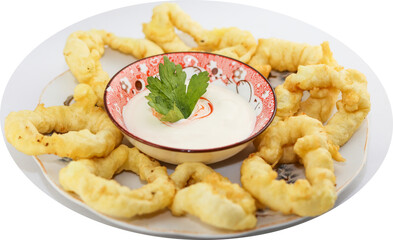 onion rings in breadcrumbs, lying on a plate with sauce