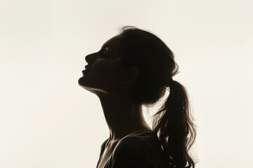 Portrait of a young woman looking up  side view   horizontal silhouette