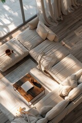 Spacious and stylish living room with white sofa, sunlight streaming in from the windows, and elegant decor.