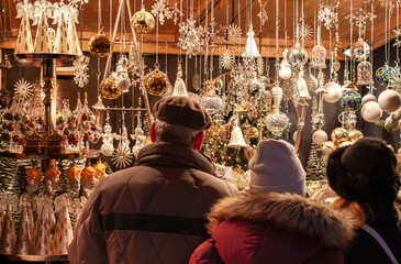 Christmas time, authentic family at market in Vienna, Austria. Traditional Viennese culture....