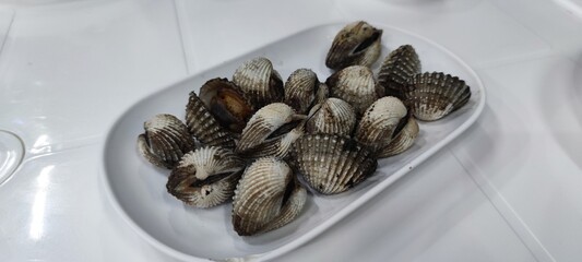 Fresh Scallops on White Plate Ready for Serving
