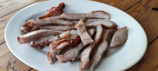 Deliciously Sliced Grilled Meat on White Plate