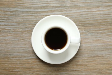 Cup of coffee on wooden background
