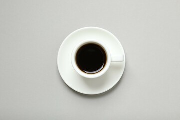 Cup of coffee on gray background