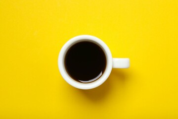 Cup of coffee on color background