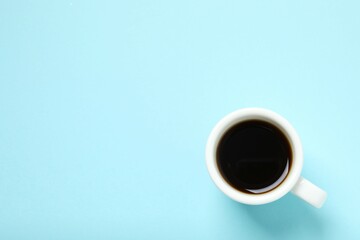 Cup of coffee on color background