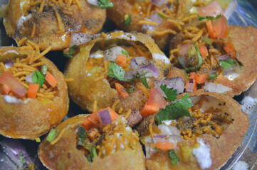 Close up to pani puri and its spicy and savory stuffing, authentic local nepali street food showing the culture and cuisine of Nepal
