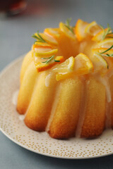 A sweet citrus cake served with oranges and lemons	