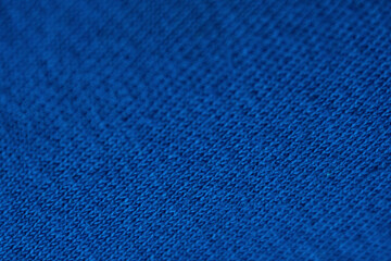 Selective focus on blue fabric creating depth and texture, giving the image an atmosphere of calm and elegance