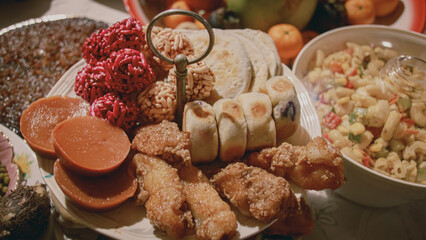 A platter featuring kutsinta, ampaw, hopia, chikalang and piaya which are traditional Filipino desserts served during the New Year's eve feast or Media Noche in the Philippines