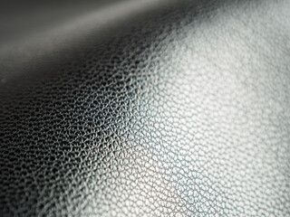 Textured leather macro background showcasing elegant lines and shades, ideal for stylish and luxurious designs