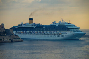 Modern Italian family cruiseship cruise ship liner Fascinosa morning arrival into port of Valletta,...