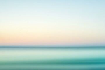 Obraz premium Blurred sunset over sea, gradient of warm to cool hues