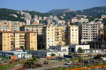 View of Genoa. Skyline of Genoa with buildings and railway.Panorama of the city with the popular buildings built on the hills. Italy