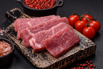 Juicy beef cut into slices with salt, spices and herbs