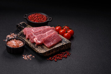 Juicy beef cut into slices with salt, spices and herbs