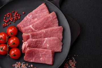 Juicy beef cut into slices with salt, spices and herbs