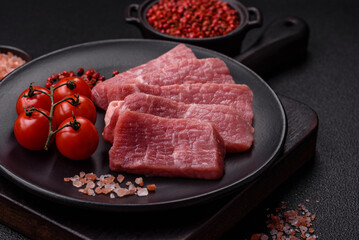 Juicy beef cut into slices with salt, spices and herbs