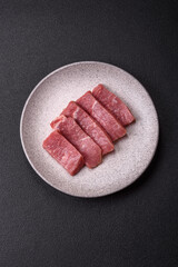 Juicy beef cut into slices with salt, spices and herbs