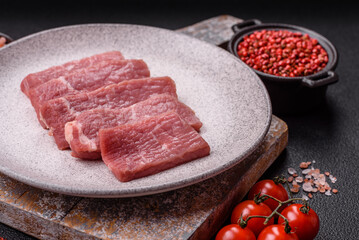 Juicy beef cut into slices with salt, spices and herbs