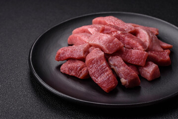Juicy beef cut into slices with salt, spices and herbs