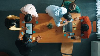 Programmer sharing Ux Ui design for mobile phone interface idea with software developer at meeting...
