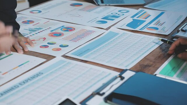 Meeting with financial advisors to analyze production costs and analyze marketing charts in business reports and adjust investment strategies to increase company profits.