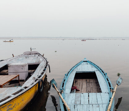 Two boats in the water of the Ganges river