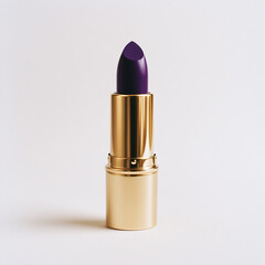 purple lipstick in a gold case on a light background with shadow