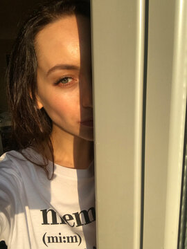 A Candid Selfie Taken in Natural Light With a Glimpse of the Eyes