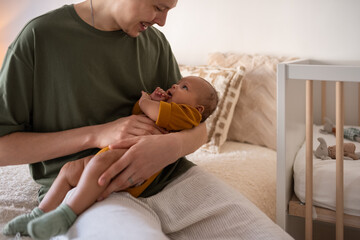 Father holding happy baby