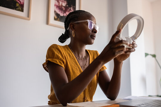 Woman putting on headphones 