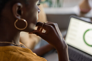 Pensive woman looking at financial data