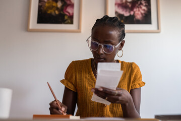 Woman analyzing her expenses
