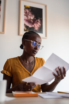 Woman reading paper letter 