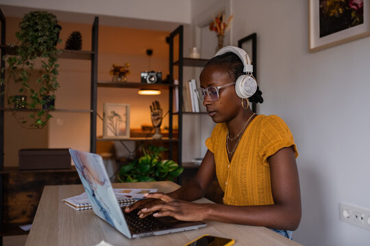 Woman typing while working at home