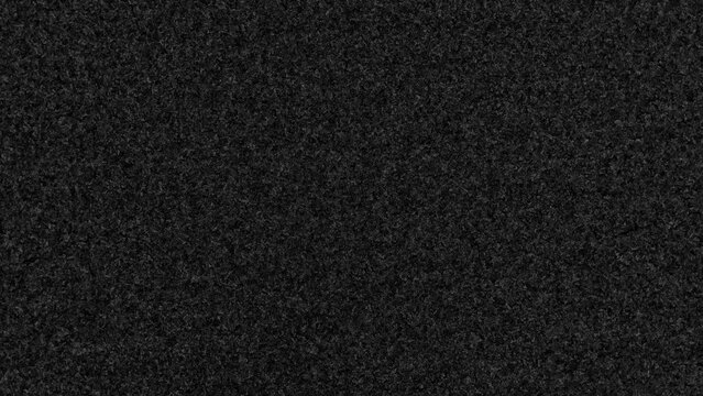 Digital photo engineering: textured black carpet with fine grain and a slight sheen. Great for backgrounds, overlays, or adding texture to digital designs.