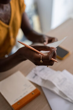 Woman reading receipt