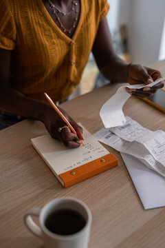 Woman calculating monthly budget