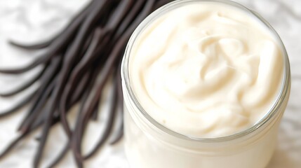 Close Up of Creamy Natural White Vanilla Yogurt in a Glass Jar with Vanilla Beans, Top View