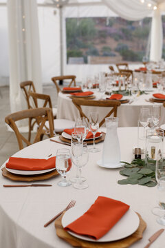 Orange napkin set up at wedding