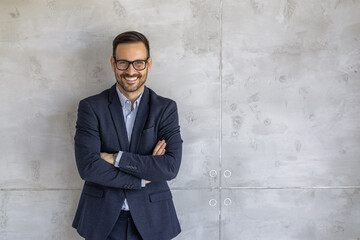 Confident Business Professional Smiling Against Gray Background