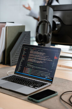 A laptop with written code