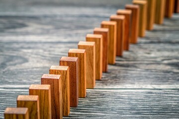 Fototapeta premium Wooden Blocks in a Line on Natural Wood Surface - Architectural Photography