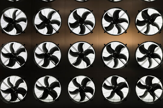 Industrial ceiling ventilation fans in a row
