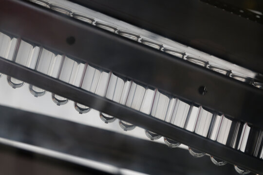 Raw plastic material for bottle blowing machine