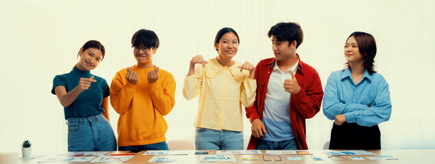 Panoramic banner young happy asian startup company employee wearing colorful casual wear stand in line together symbolize creative teamwork, job employment, HR agency recruitment. Synergic