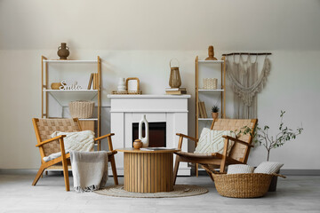 Armchairs, coffee table and fireplace in living room