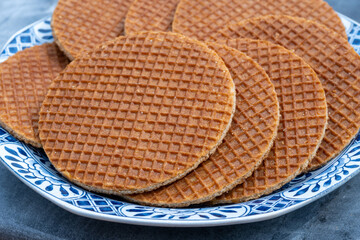 Traditional Dutch sweet dessert, Butter caramel syrup waffles, fresh baked